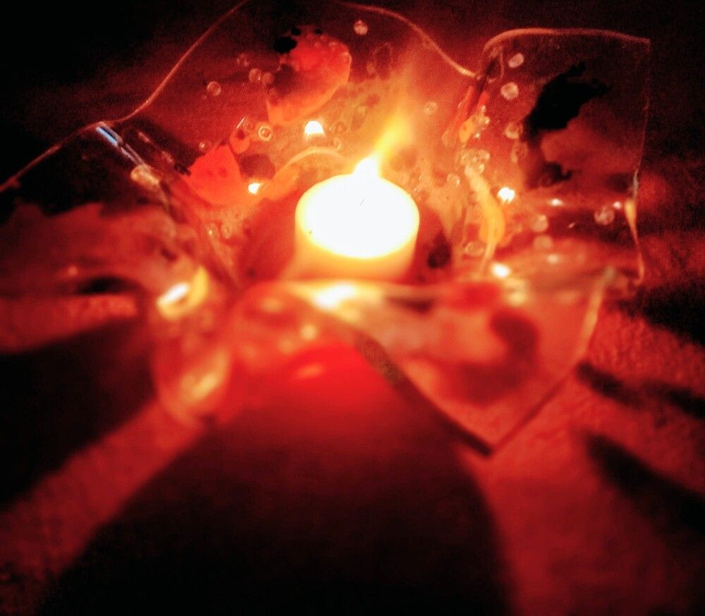 Vela en capelina de vidrio.