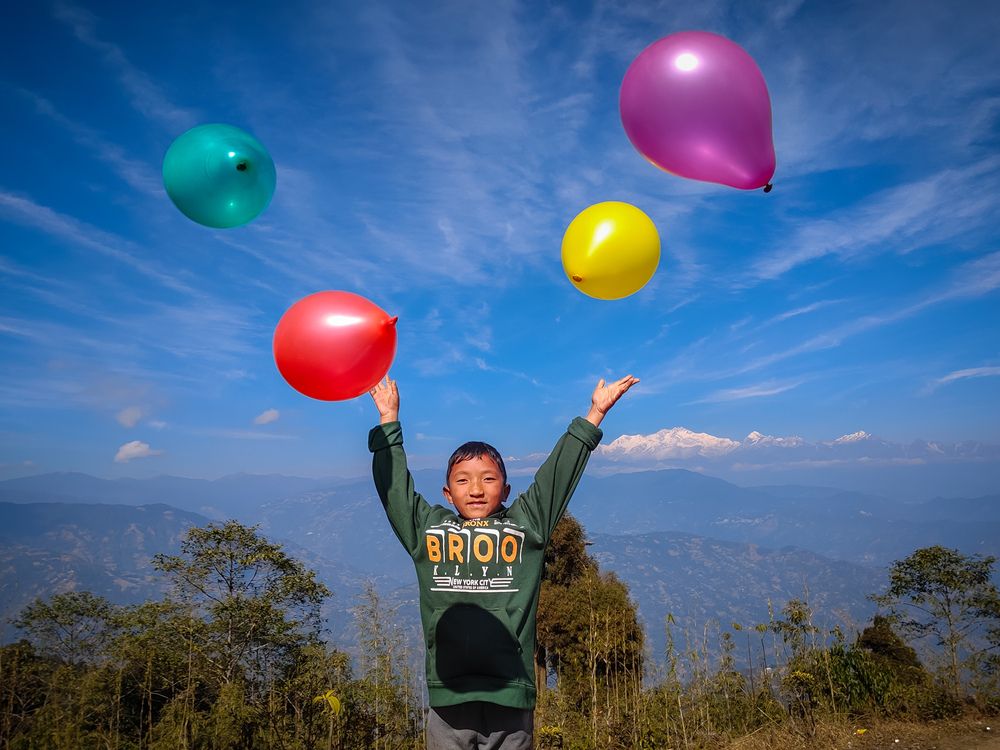 A Colourful Celebration Against the Himalayan Range