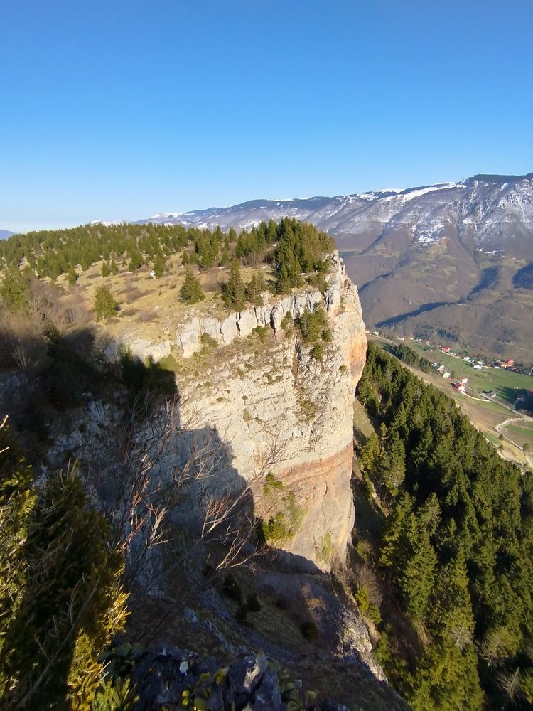 Majestic Cliffside Plateau Overlooking a Remote Mountain Valley