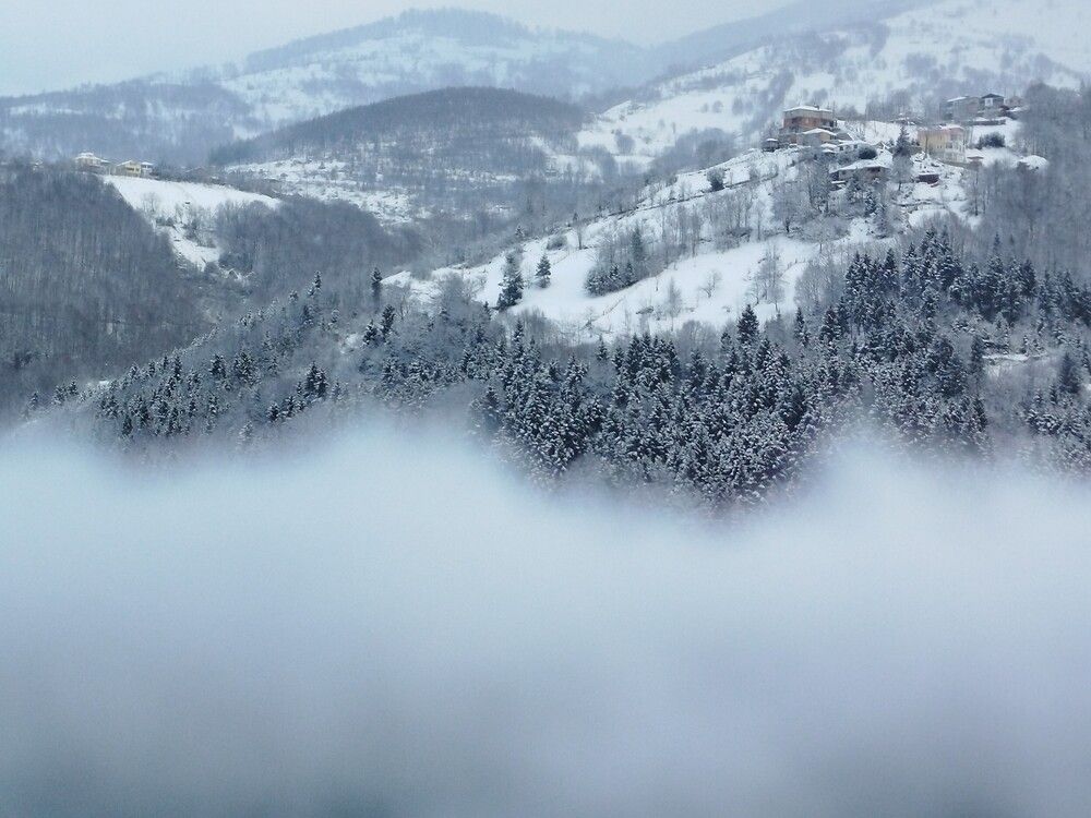 Snowy Turkish Mountain Village Above a Sea of Fog