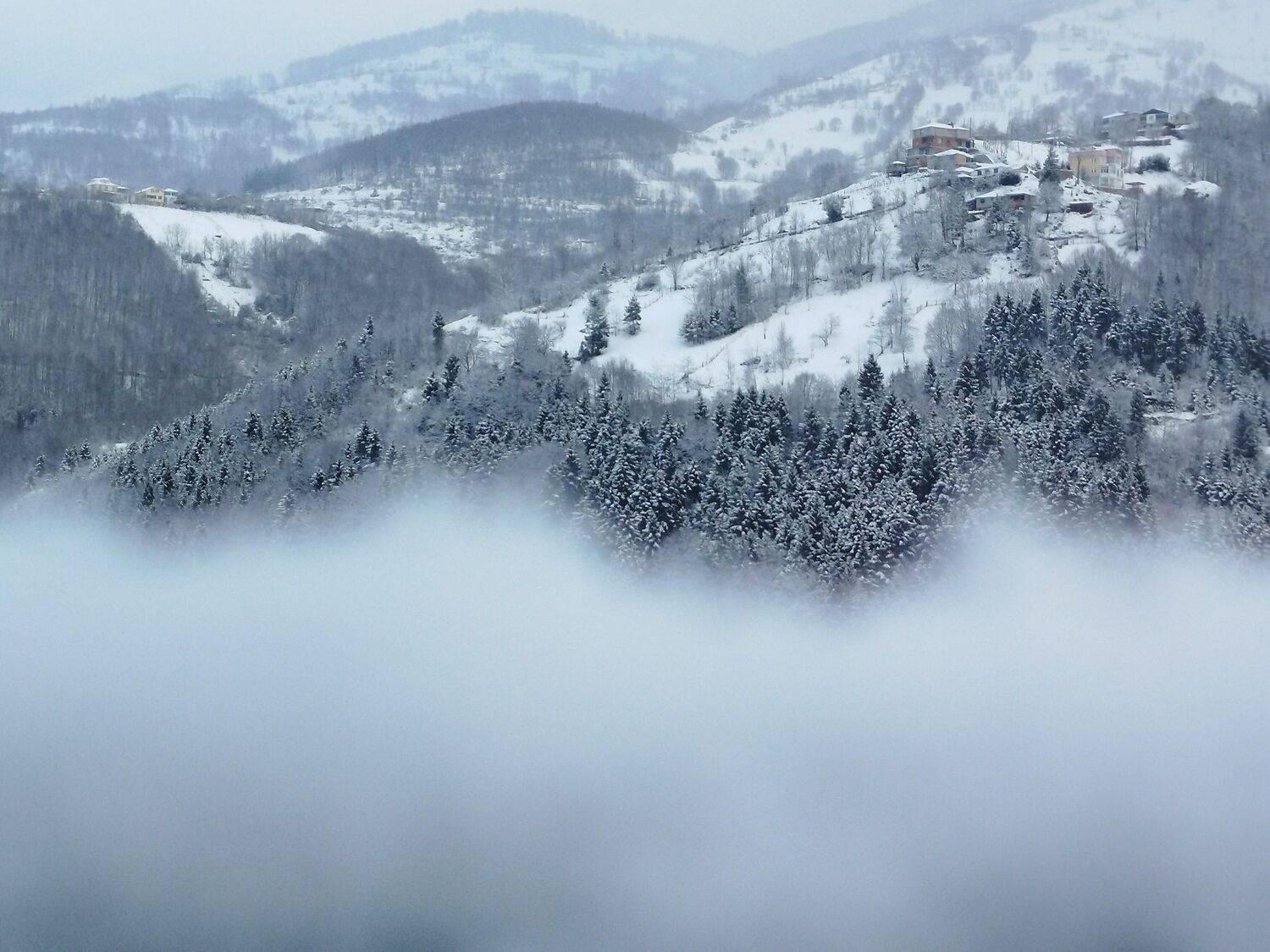 Snowy Turkish Mountain Village Above a Sea of Fog