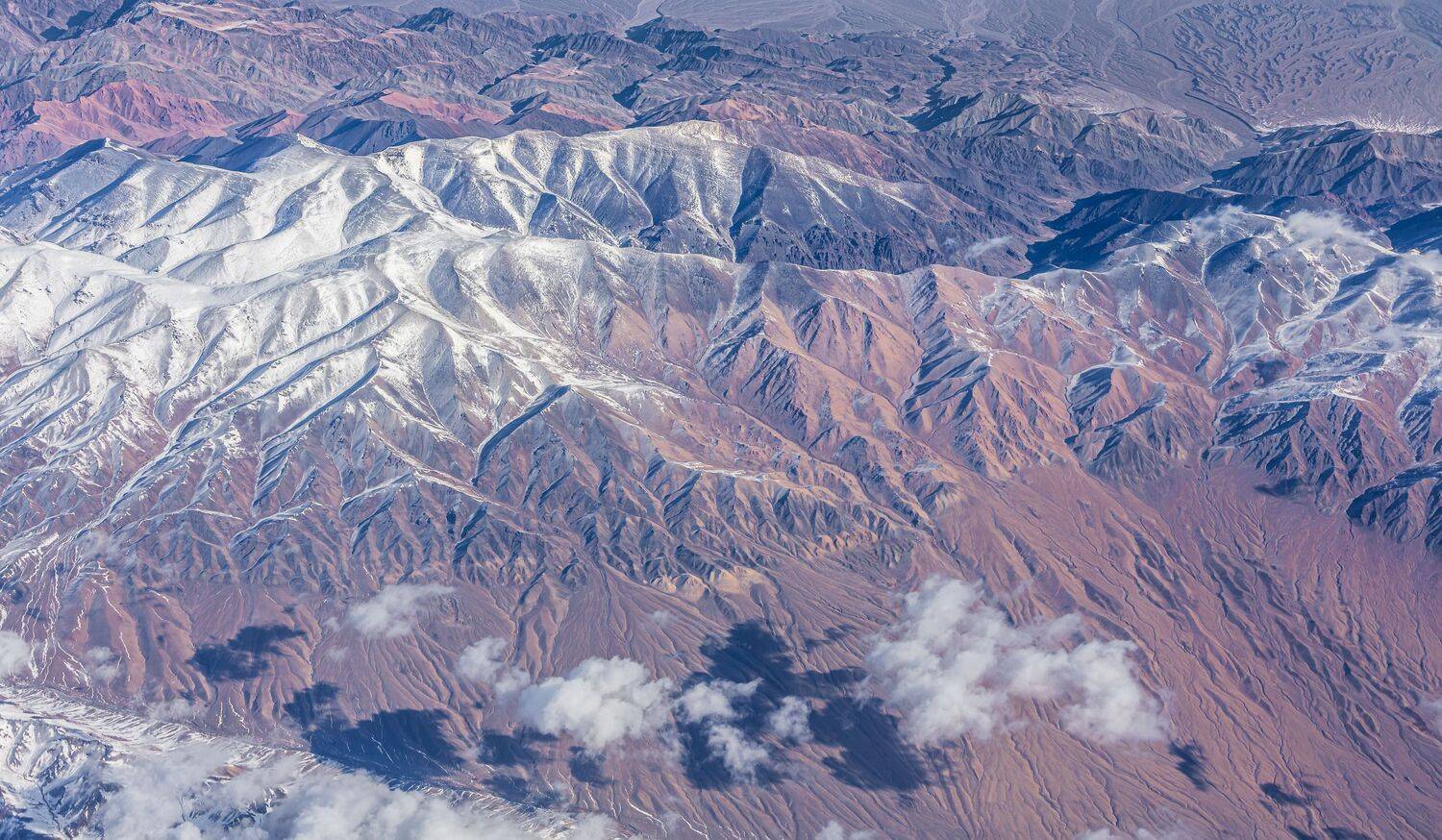 The snow-capped mountain ranges