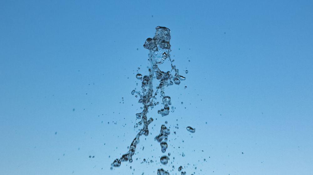 The moment with the disintegrating stream of water