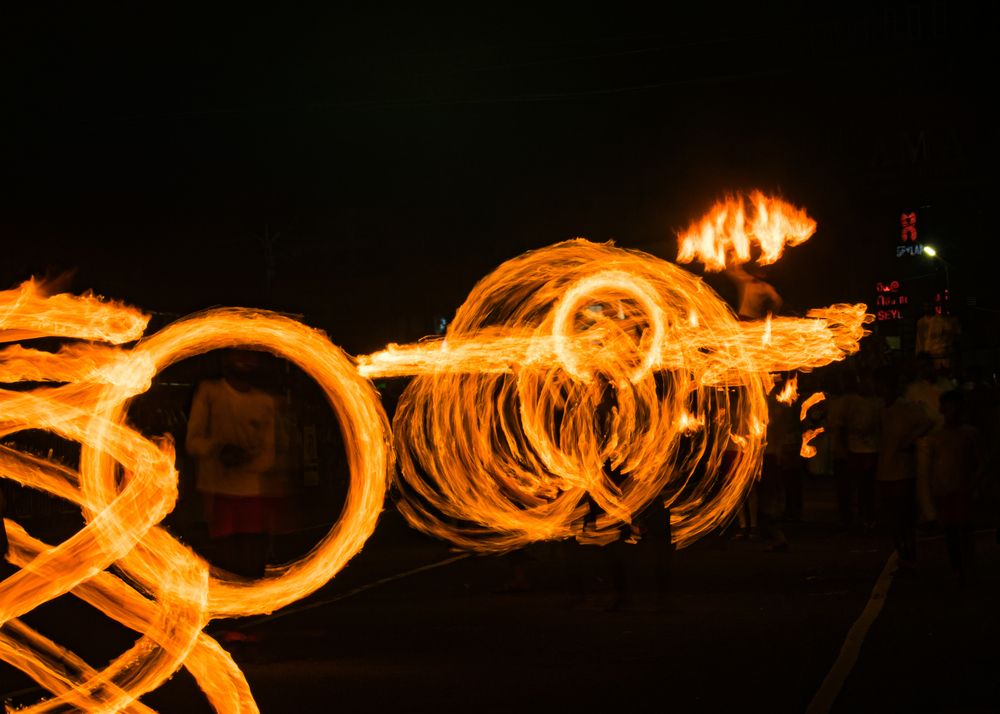 Dancing with fire under the silent night.