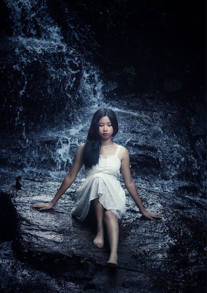 SHE The woman in front of the waterfall,The Source: Ethereal Resilience