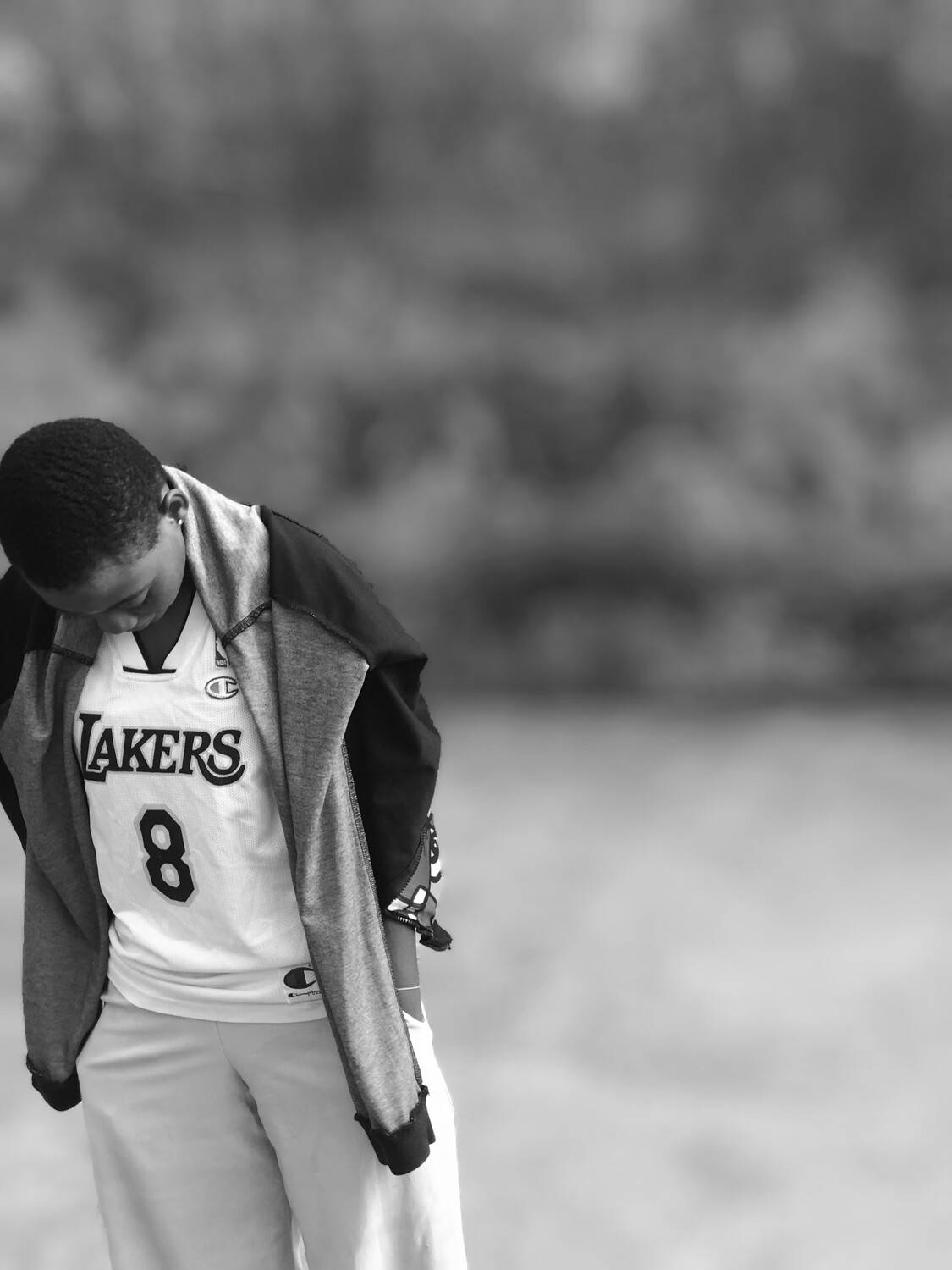 Young Person in Lakers Jersey Looking Down
