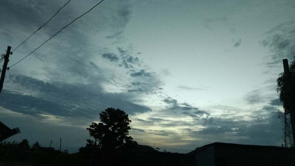 Moody Evening Sky Over Rural Silhouette.