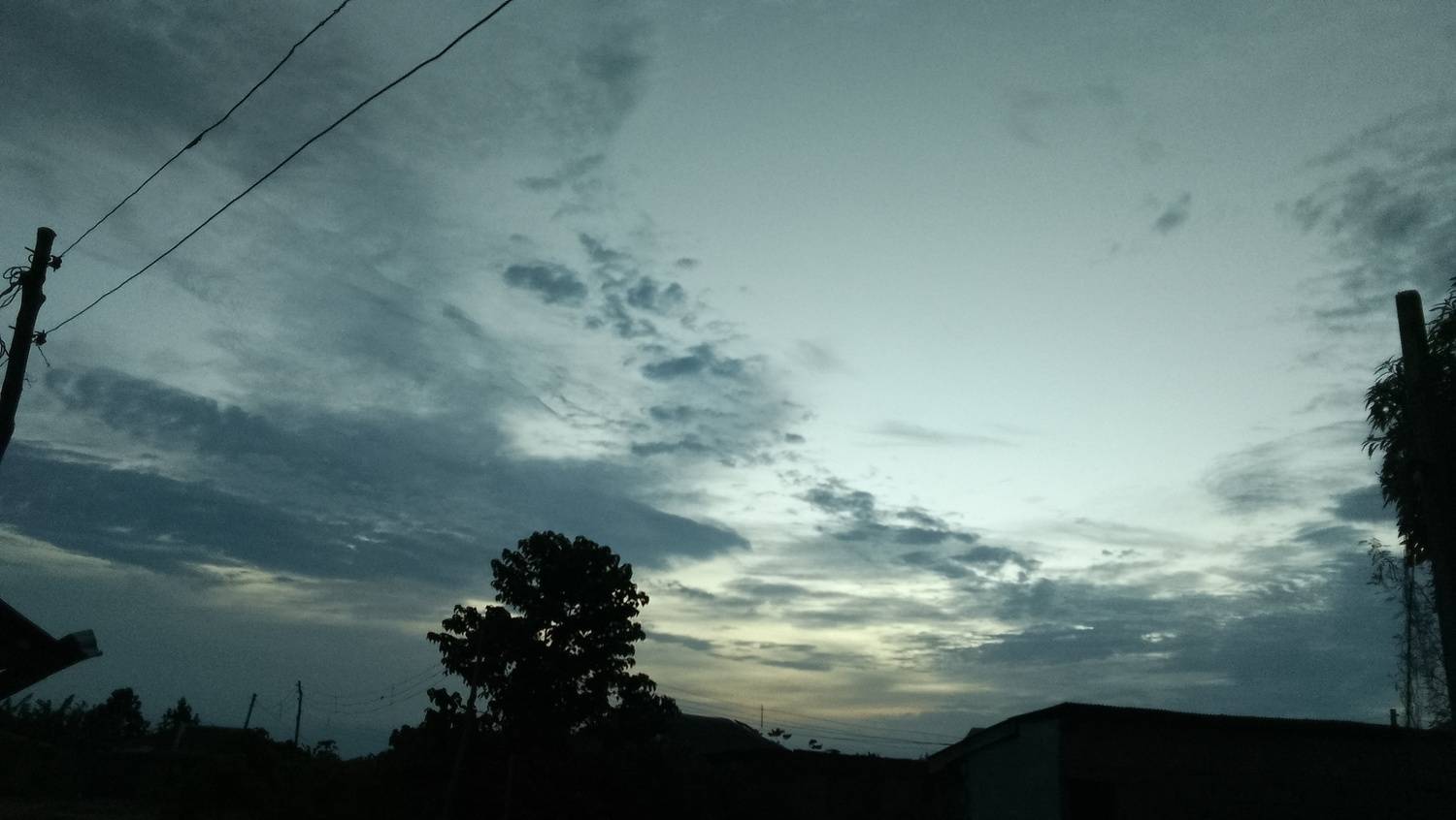 Moody Evening Sky Over Rural Silhouette. Moody Evening Sky Over Rural Silhouette.