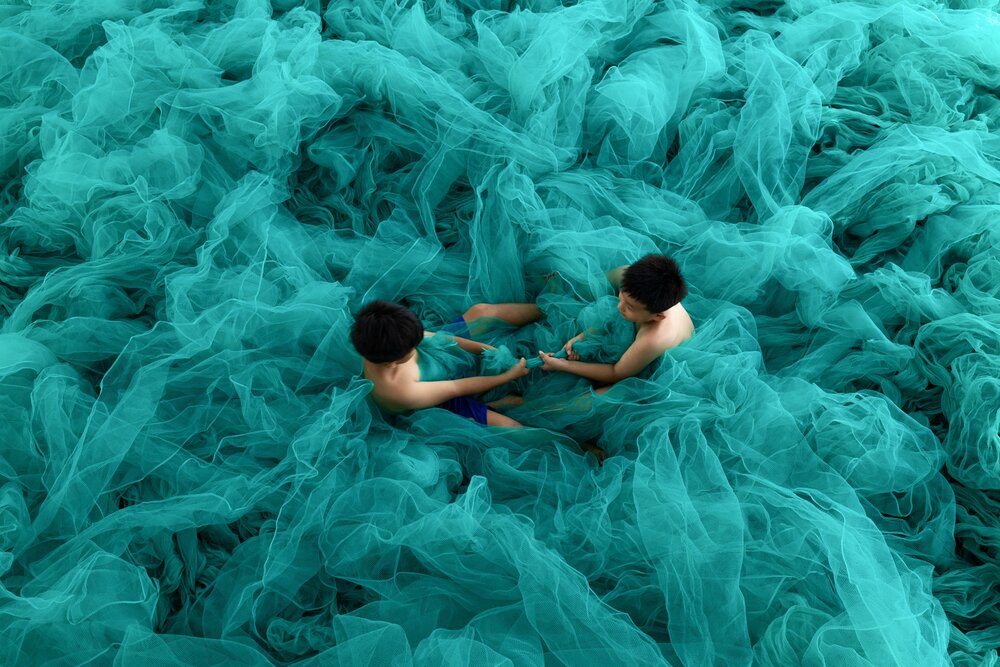 Children\'s games in fishing nets, Vietnam