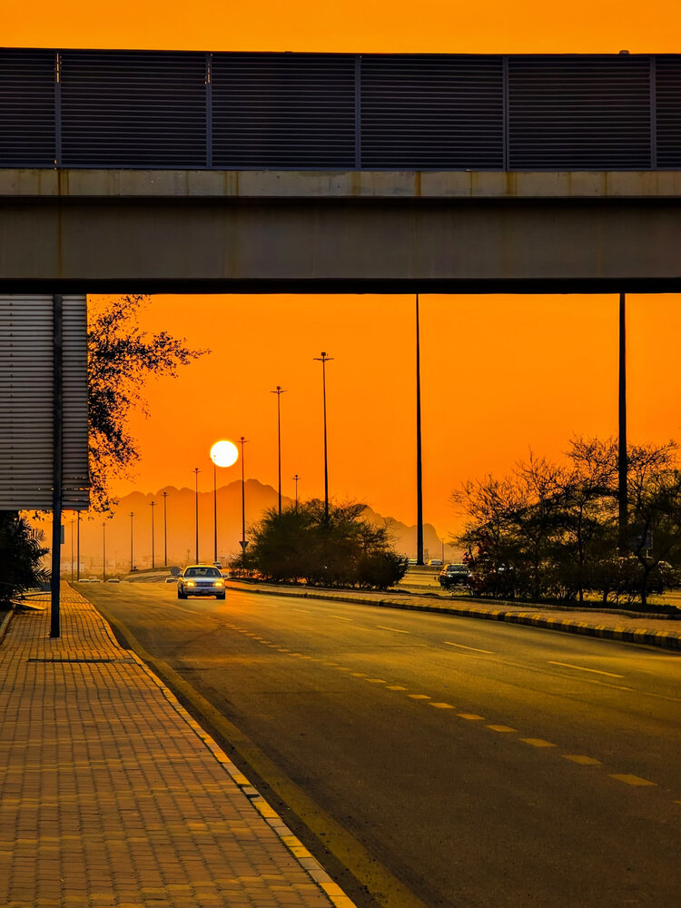 Golden Urban Sunset: A Serene Journey on the Highway