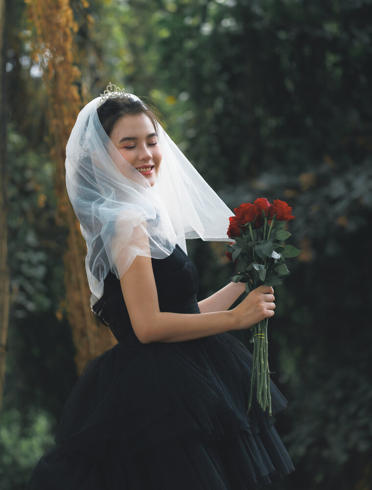 Veiled Elegance with Red Roses