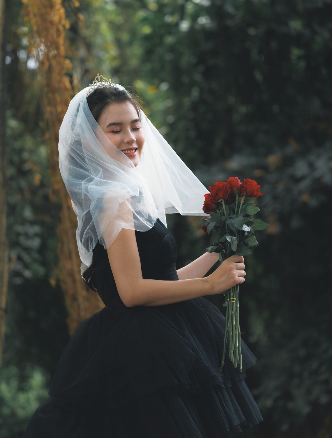 Veiled Elegance with Red Roses