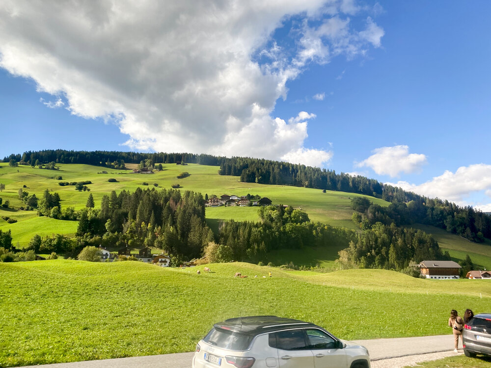 Clouds over a green plain
