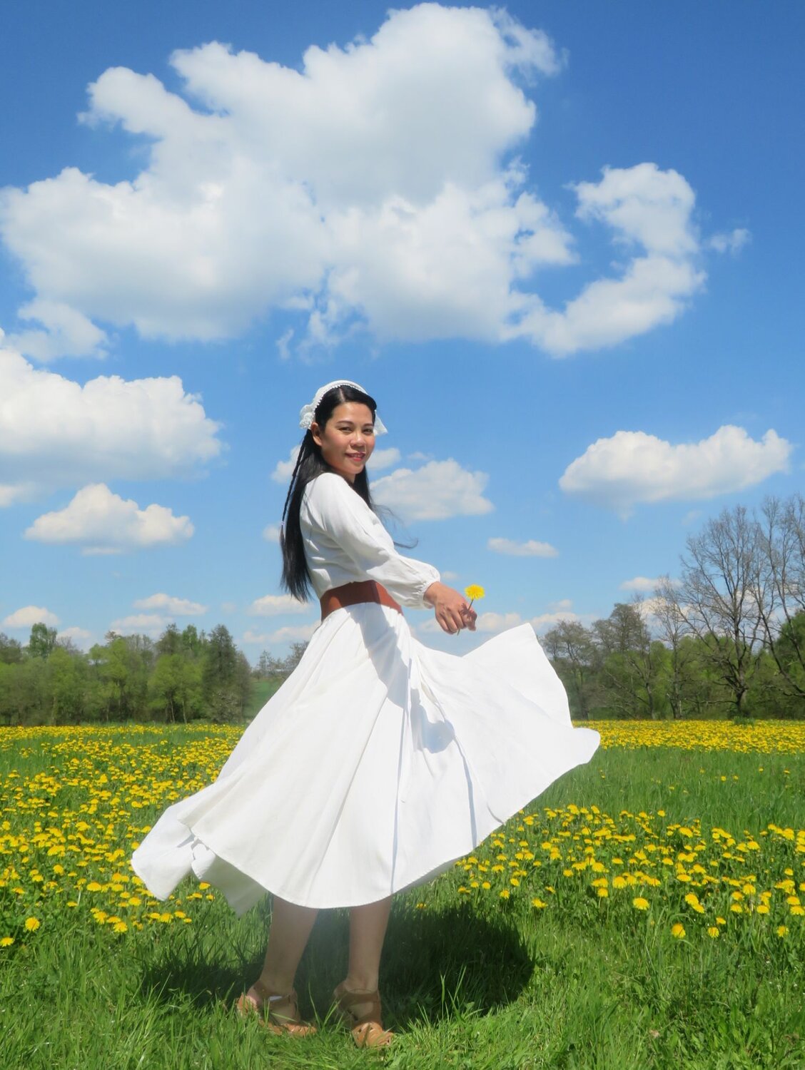 Girl in White Dress in Village Field