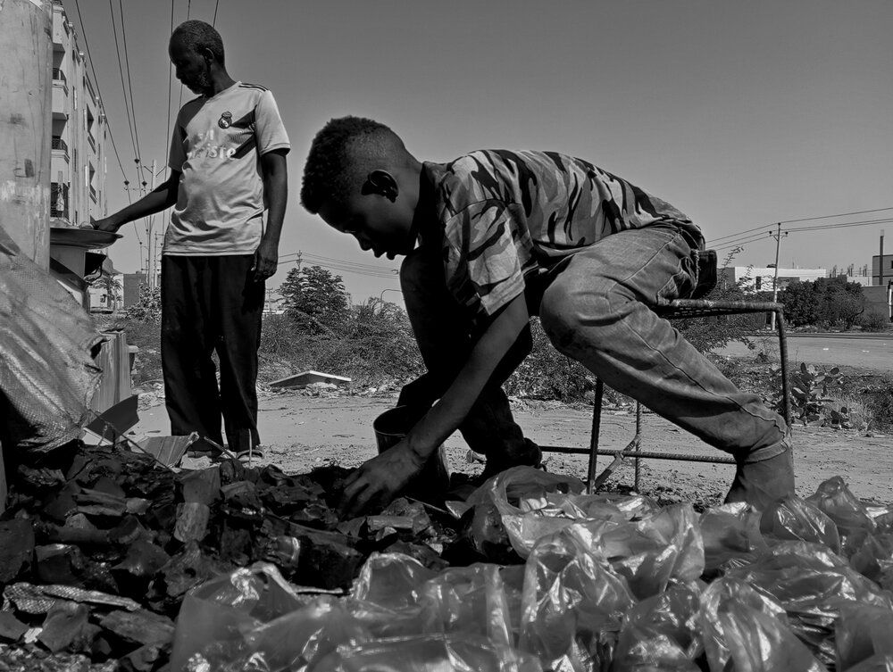 Hands of Labor Charcoal and Childhood in the Streets