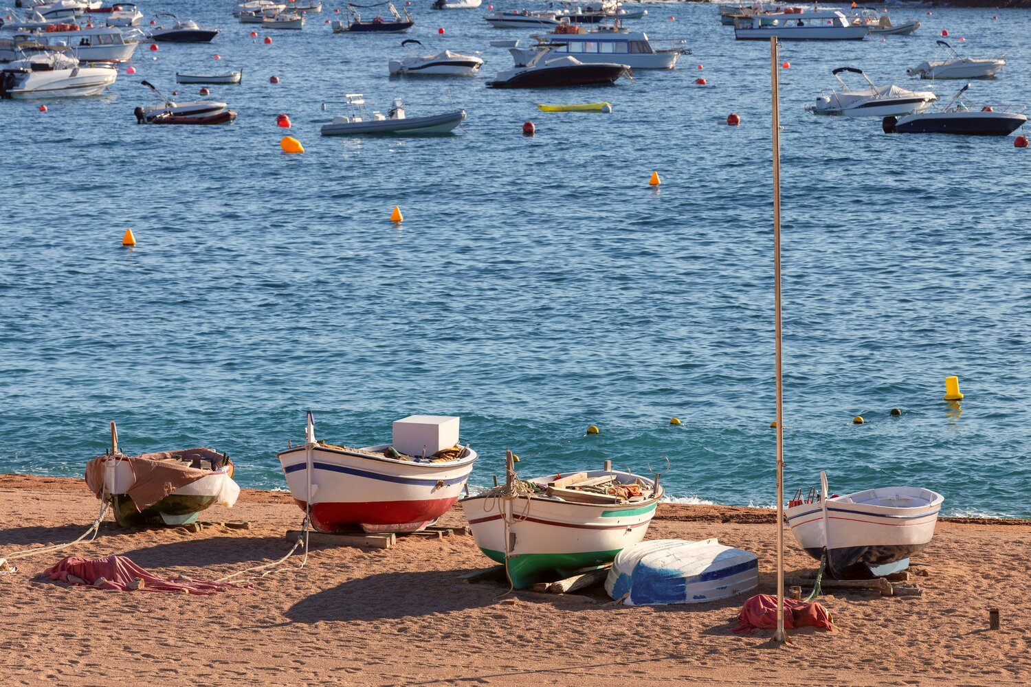 Traditional Fishing Boats on Sandy Beach in Tossa de Mar, Spain