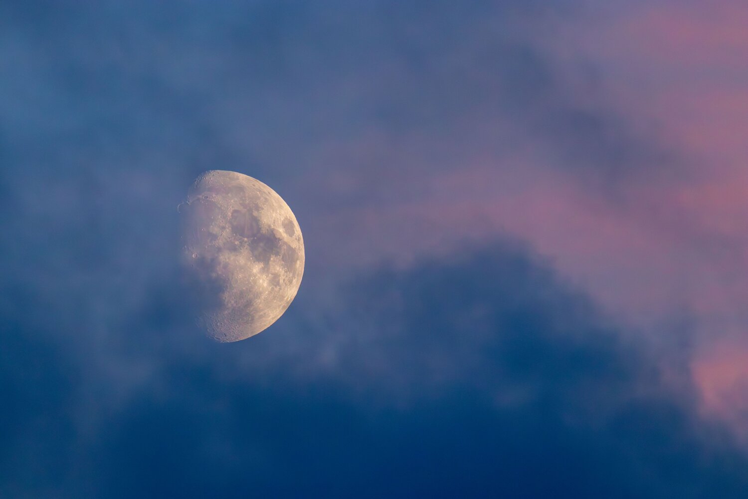 The Moon in her veils of color