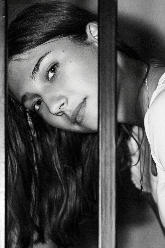 Face illuminated from shadow with a soft gaze