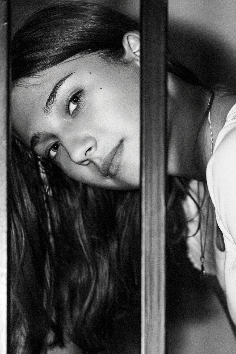 Face illuminated from shadow with a soft gaze