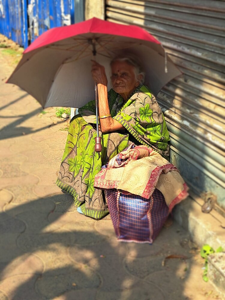 The lady with the red umbrell
