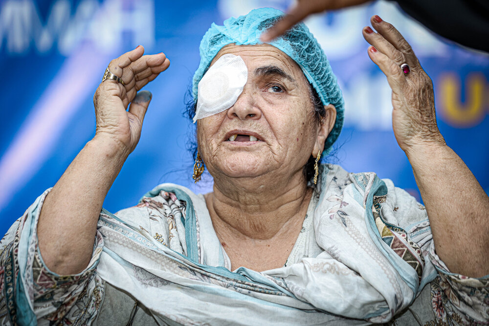 Woman Celebrates After Cataract Surgery at Eye Care Camp