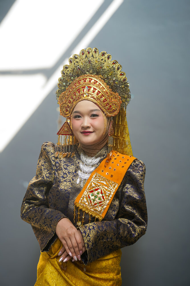 Young Minangkabau Woman in Traditional Indonesian Wedding Dress Wearing Suntiang Headdress