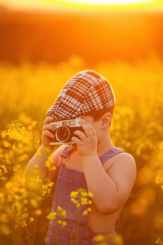 A boy and his toy camera