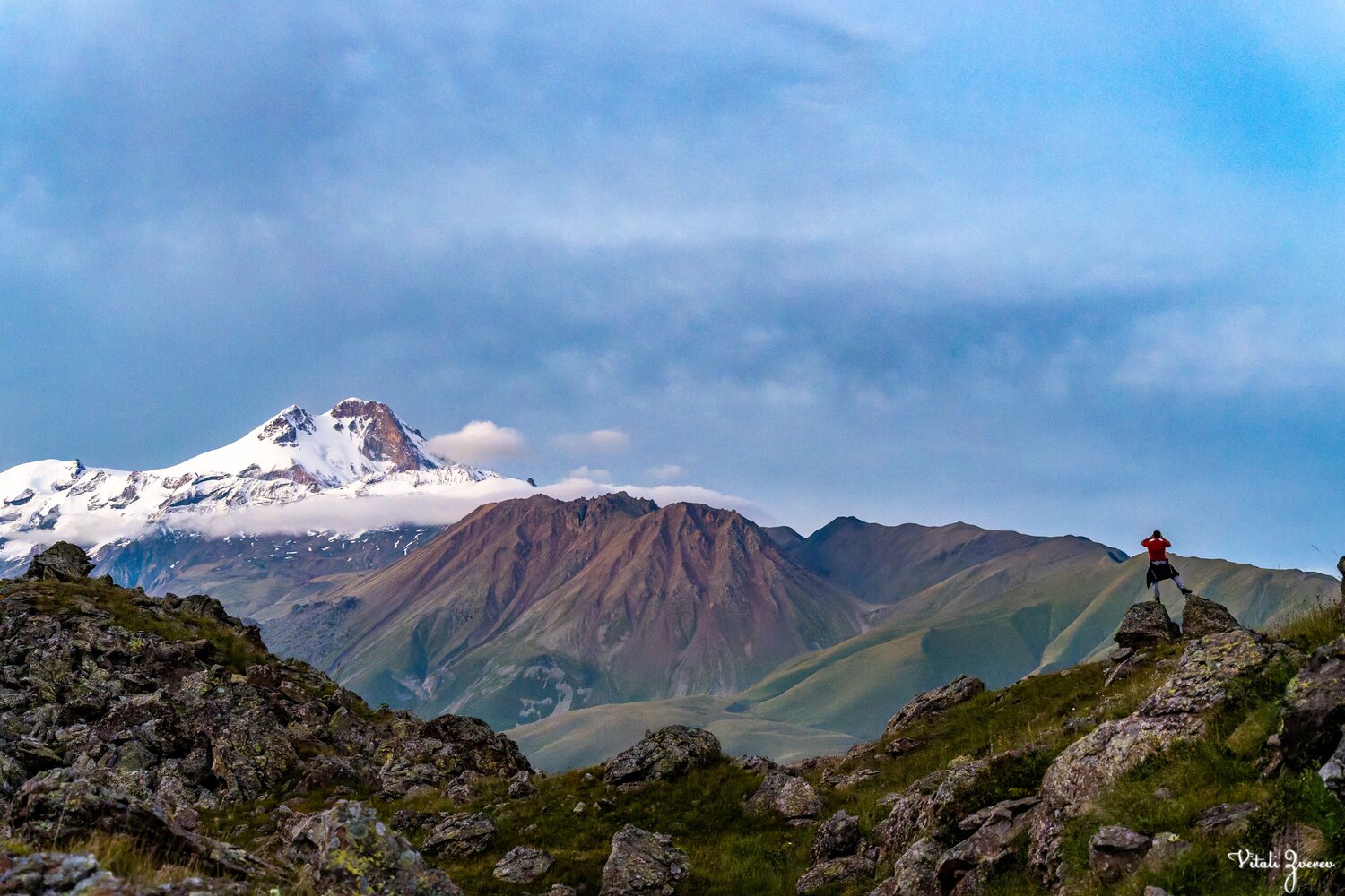 Hiker looking at Mkinvartsveri peak from Samotkhis campsite in Georgia