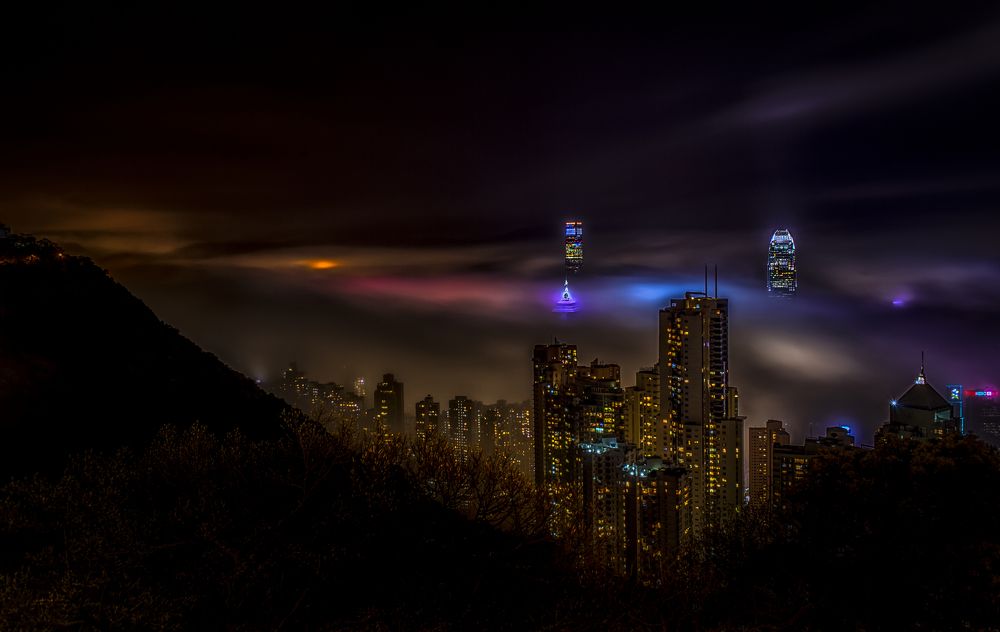 foggy night transilluminates Hong Kong