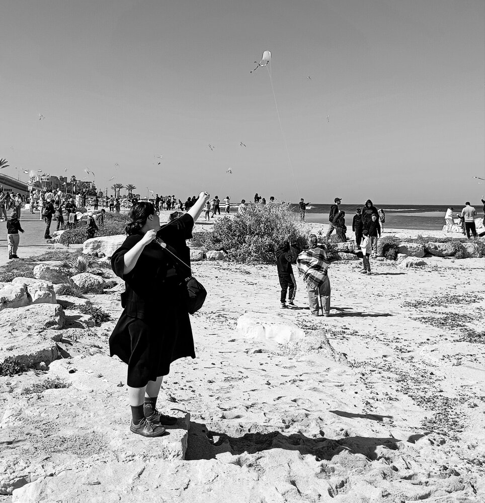 Flying a kite.