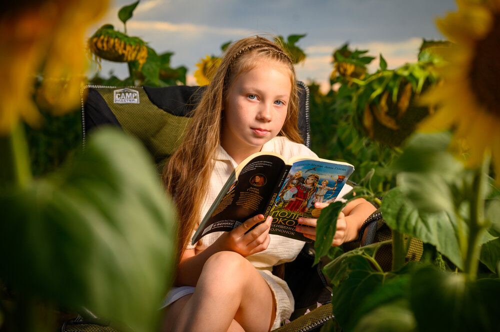 Summer, a book, and sunflowers
