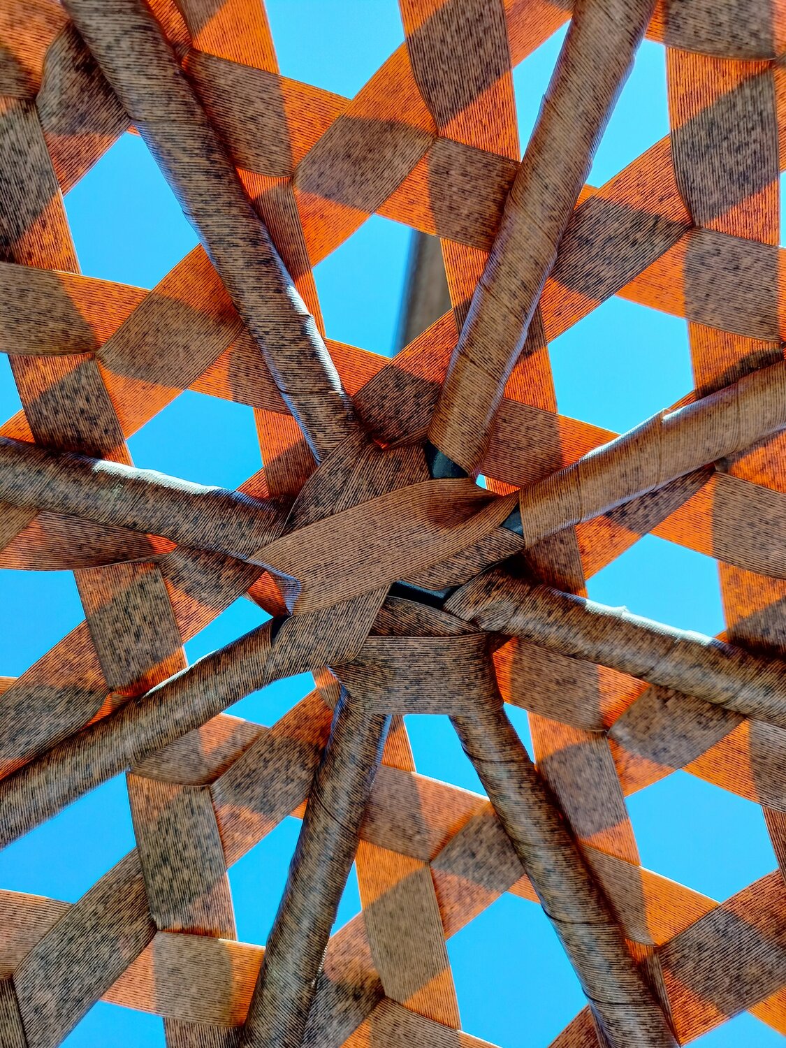 Woven palm leaf beach parasol umbrella