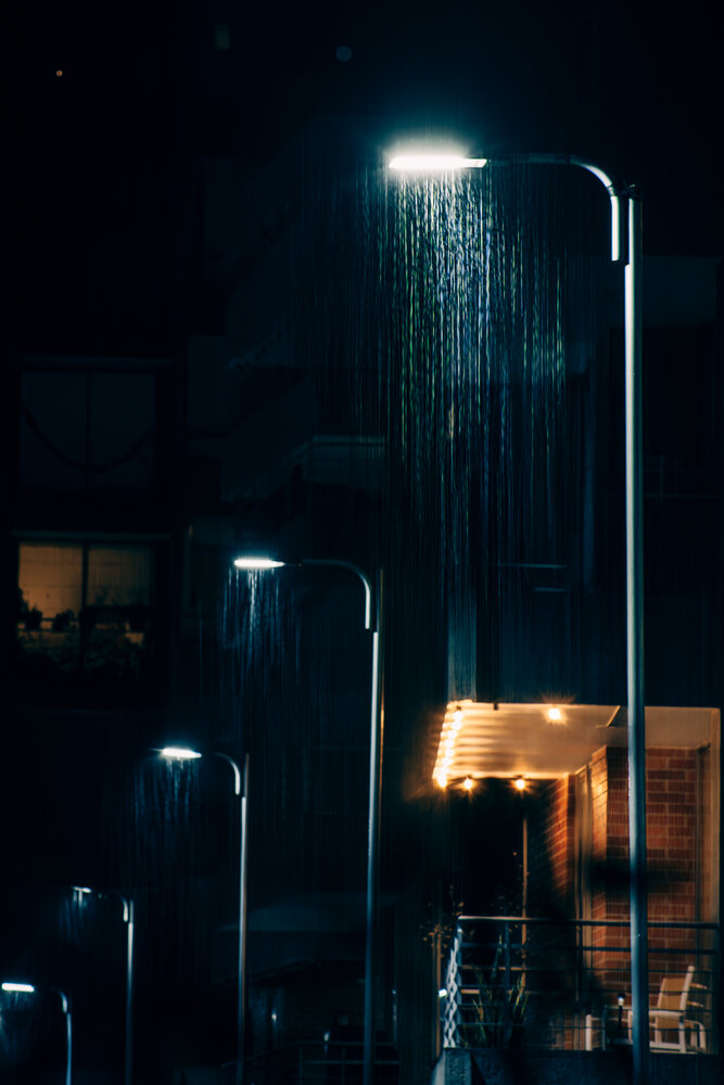 Luminous Downpour on a Nocturnal Street