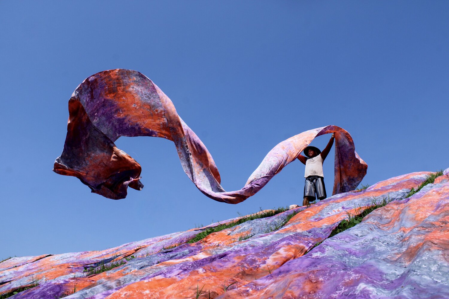 Spreading out beach towels and hopes in Mojolaban