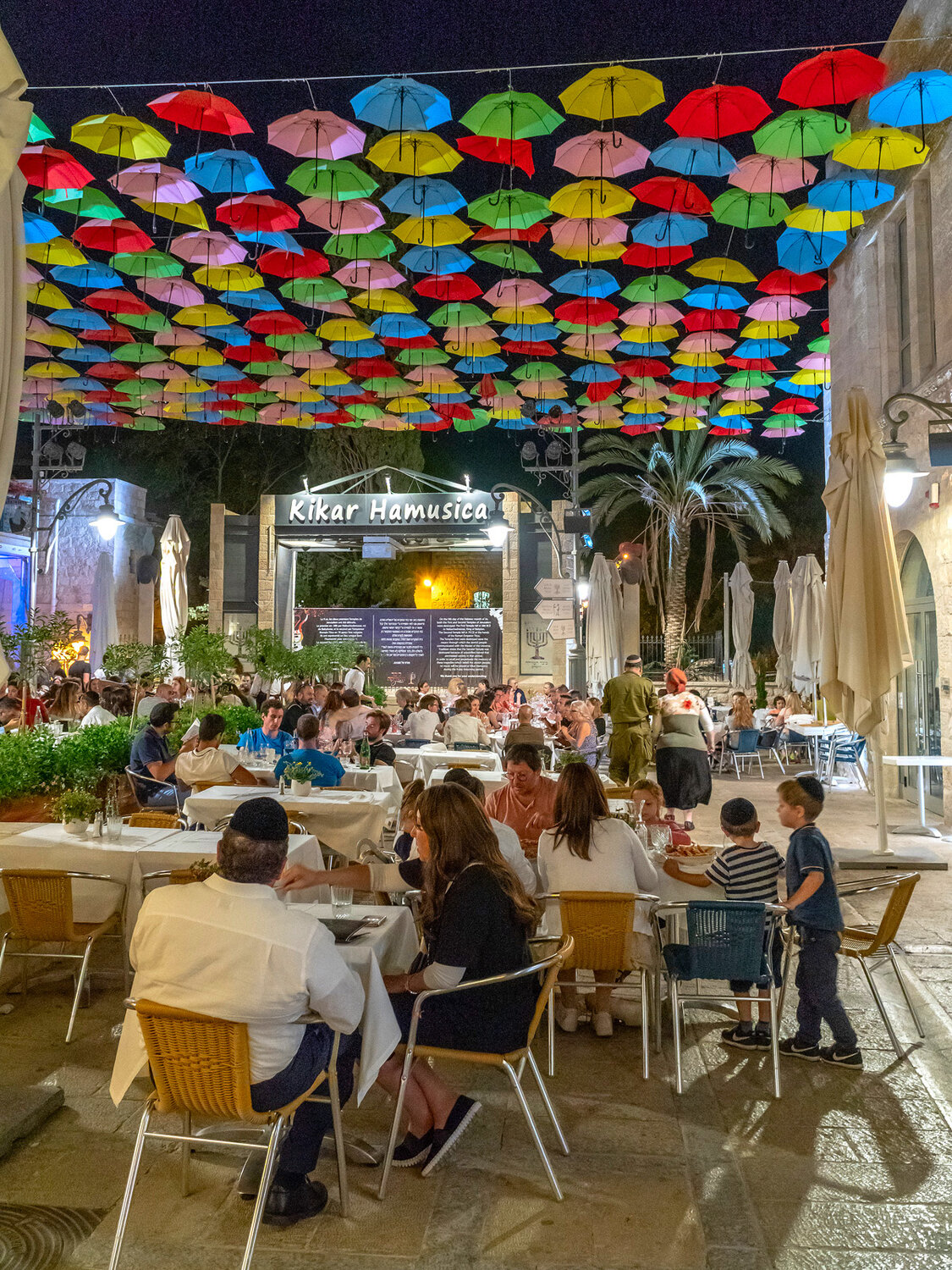 An Evening Beneath Colourful Umbrellas / Вечер под разноцветными зонтами