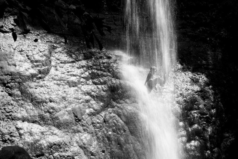 kids play at waterfall