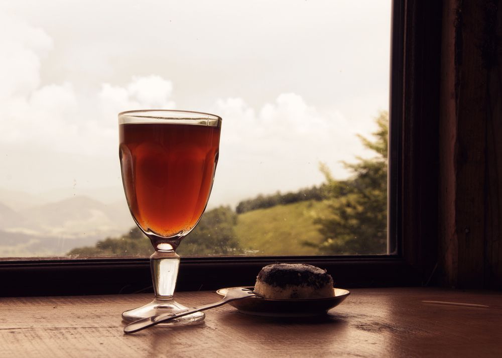 Hot drink and cake in mountains