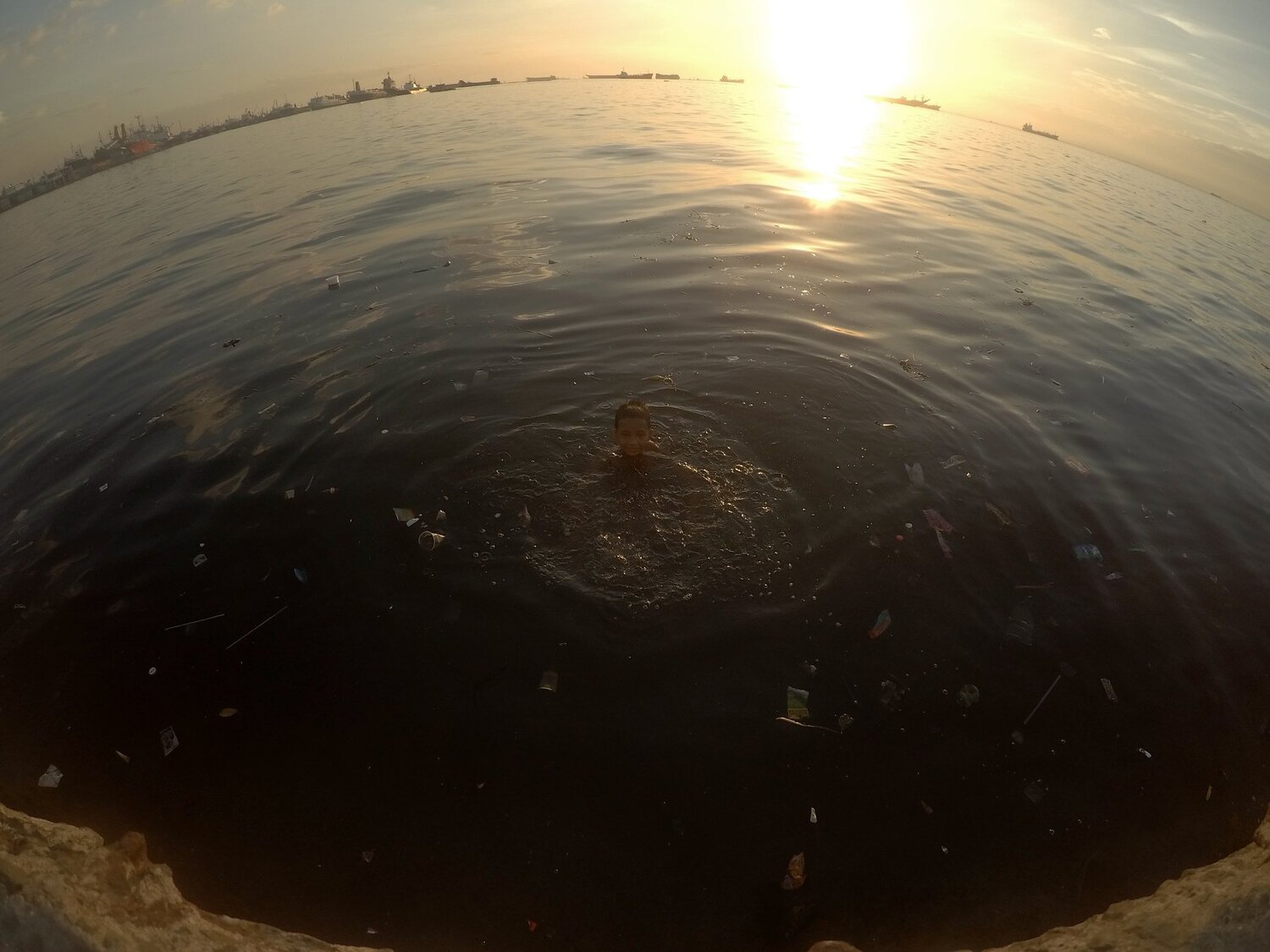 "Sa talukap ng dagat, musmos palimos ng pangarap" (At the eyelids of the sea, innocent alms for dreams.)