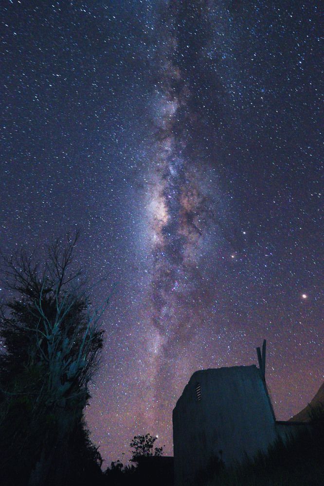 Damaged Houses Under The Milky Way