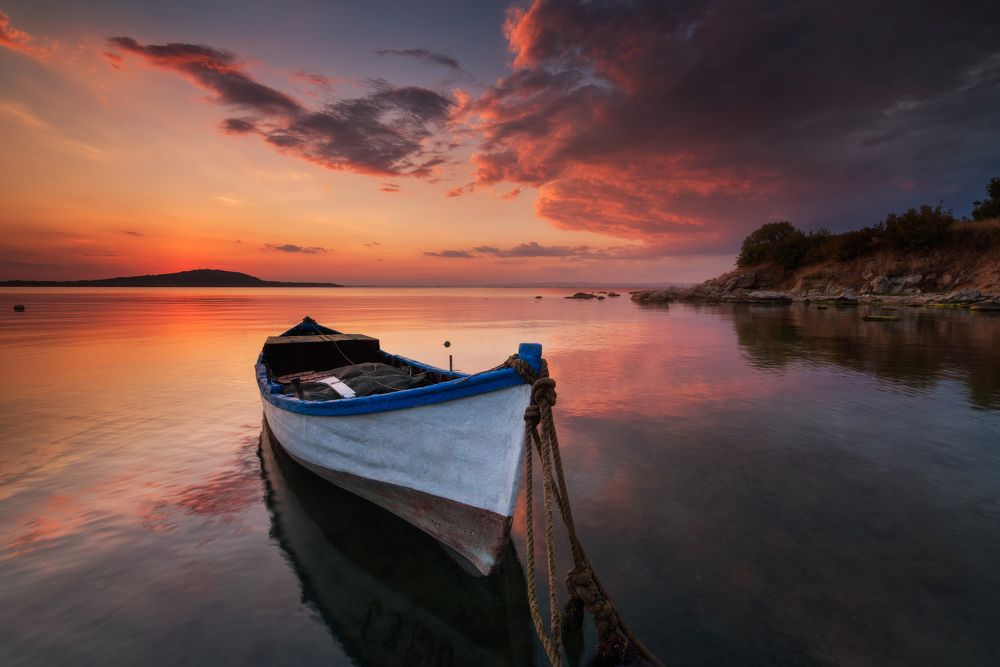 Lonely boat at sunset