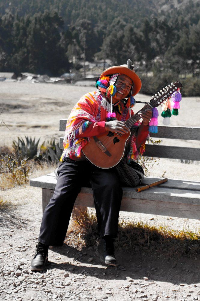 Cheerful Guitarist in Cusco