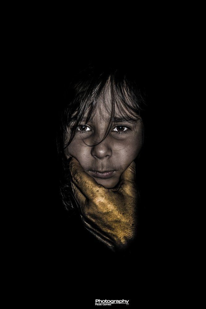 Hand against face