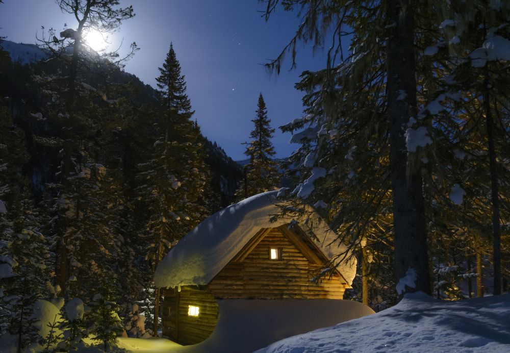 Forest hut winter moonlit night