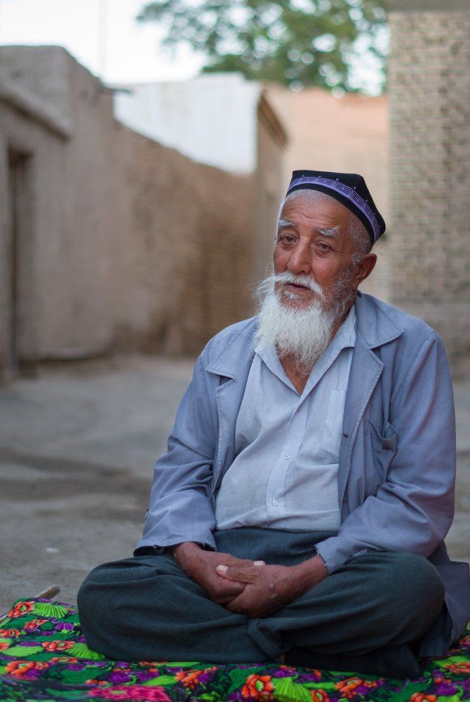 Uzbek man sitting on the street