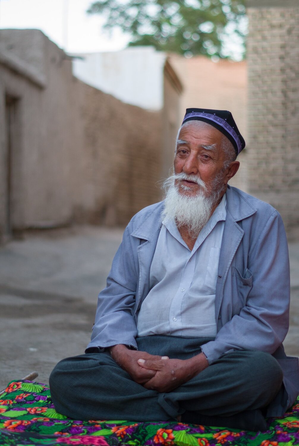 Uzbek man sitting on the street