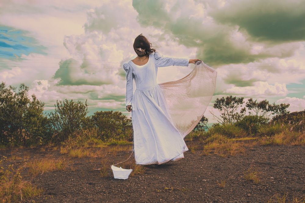 Bride Draging The Weight of The World in A Paper Boat