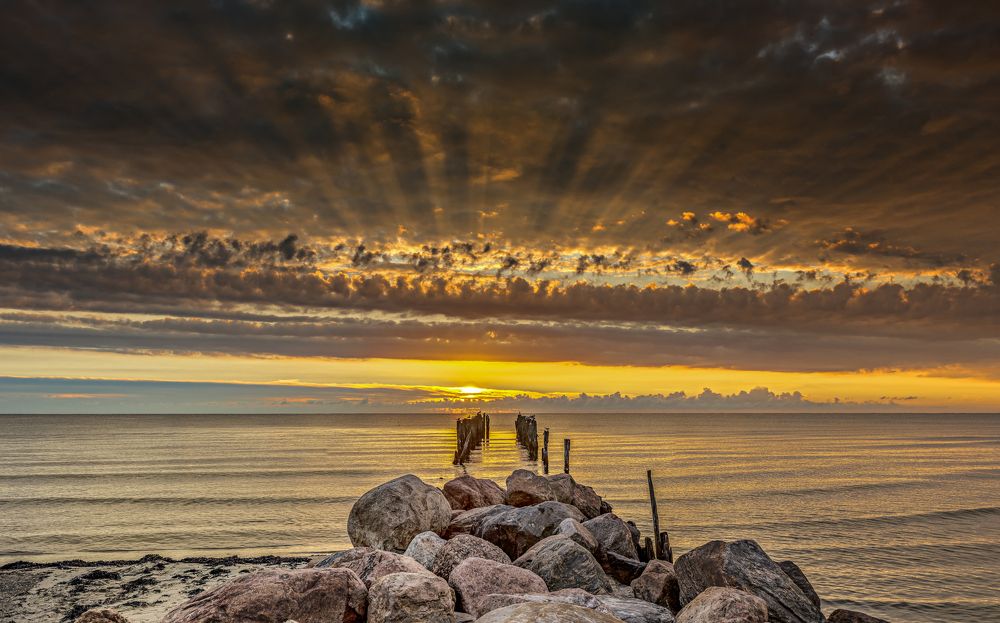 Sunrise at old broken pier, Baltic Sea, East Europe