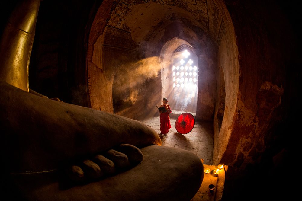 Buddhist novice praying