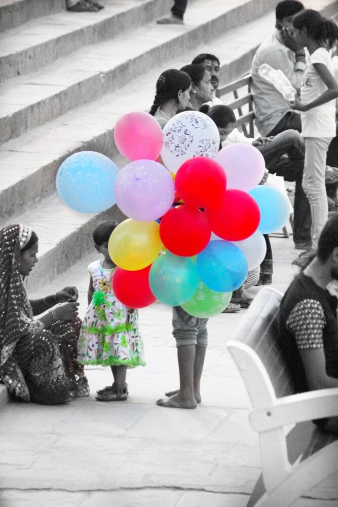 "a childhood hidden behind the baloons for livlihood"