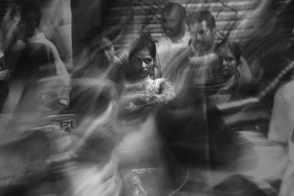 Standing alone in the crowd.